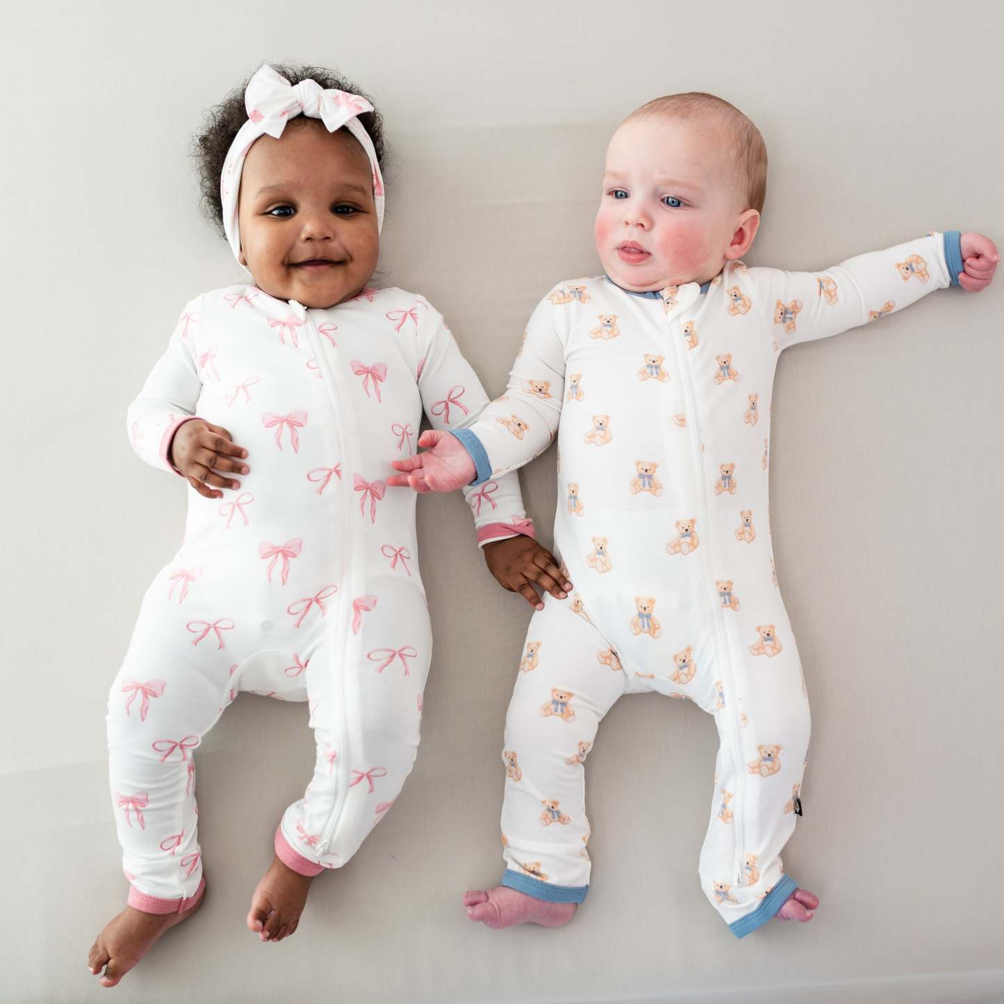 2 babies wearing Zippered Romper in Bow and Teddy Bear