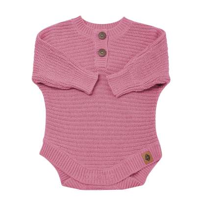 Chunky Knit Romper in Apple Blossom shown with the arms folded inwards
