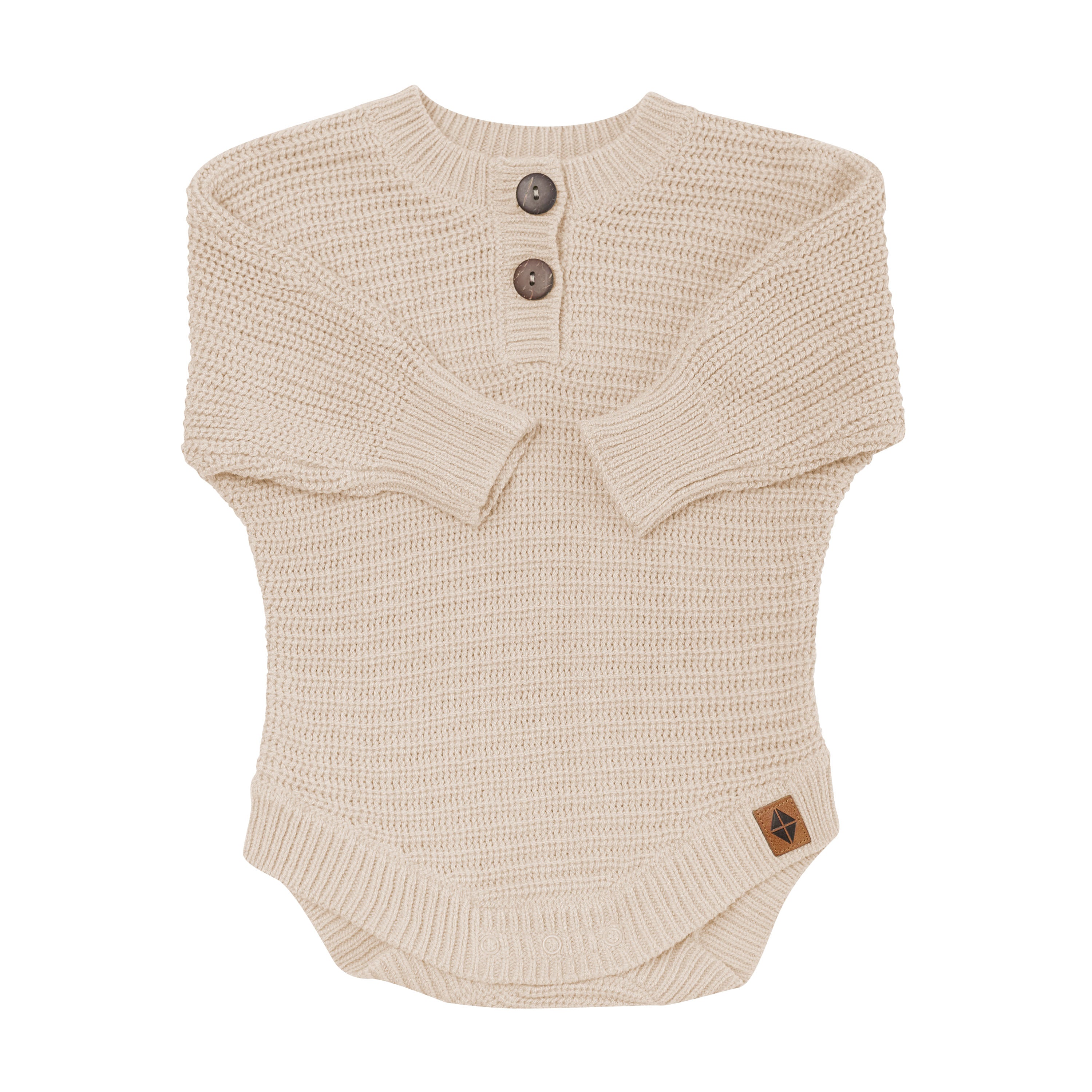 Chunky Knit Romper in Almond shown with the arms folded inwards