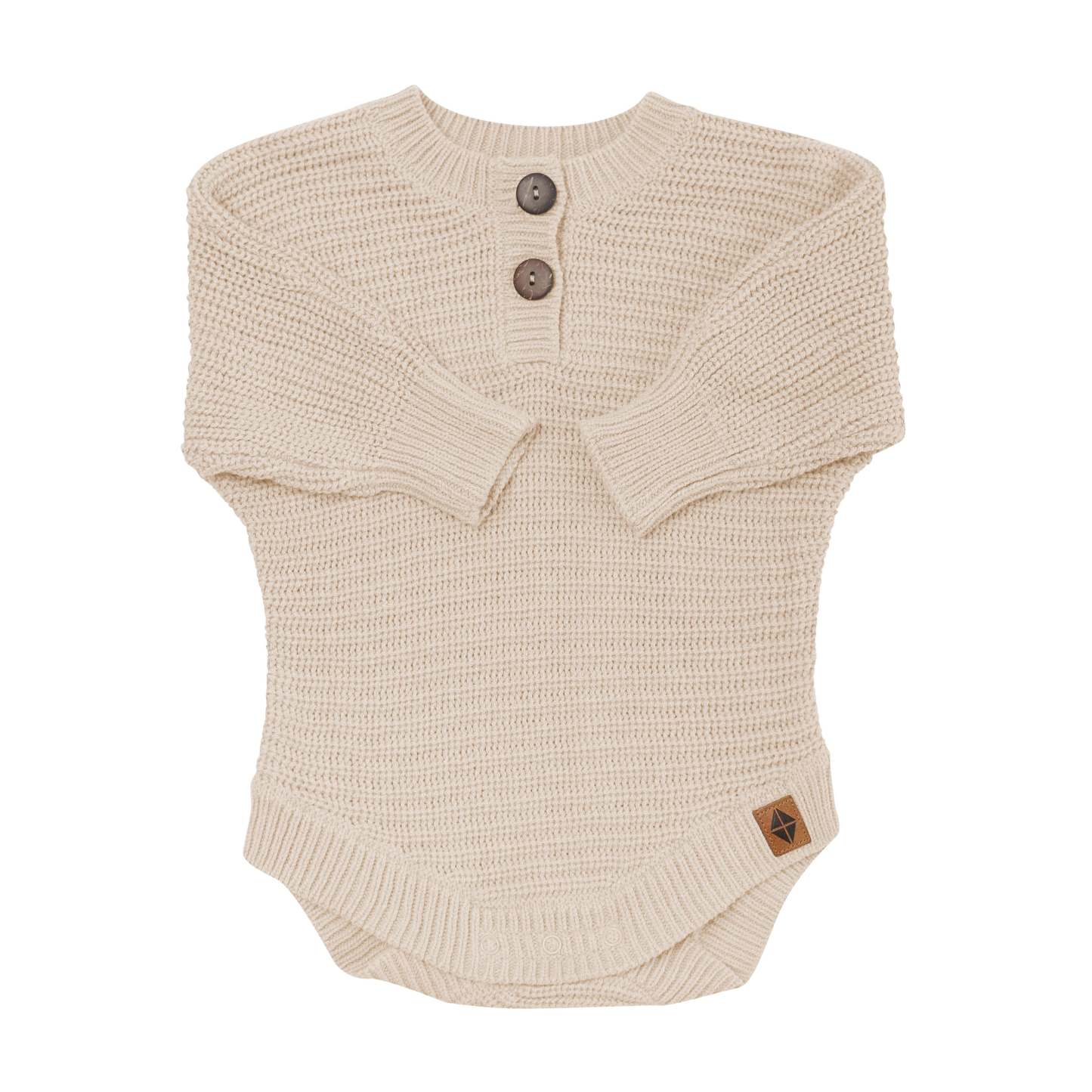 Chunky Knit Romper in Almond shown with the arms folded inwards