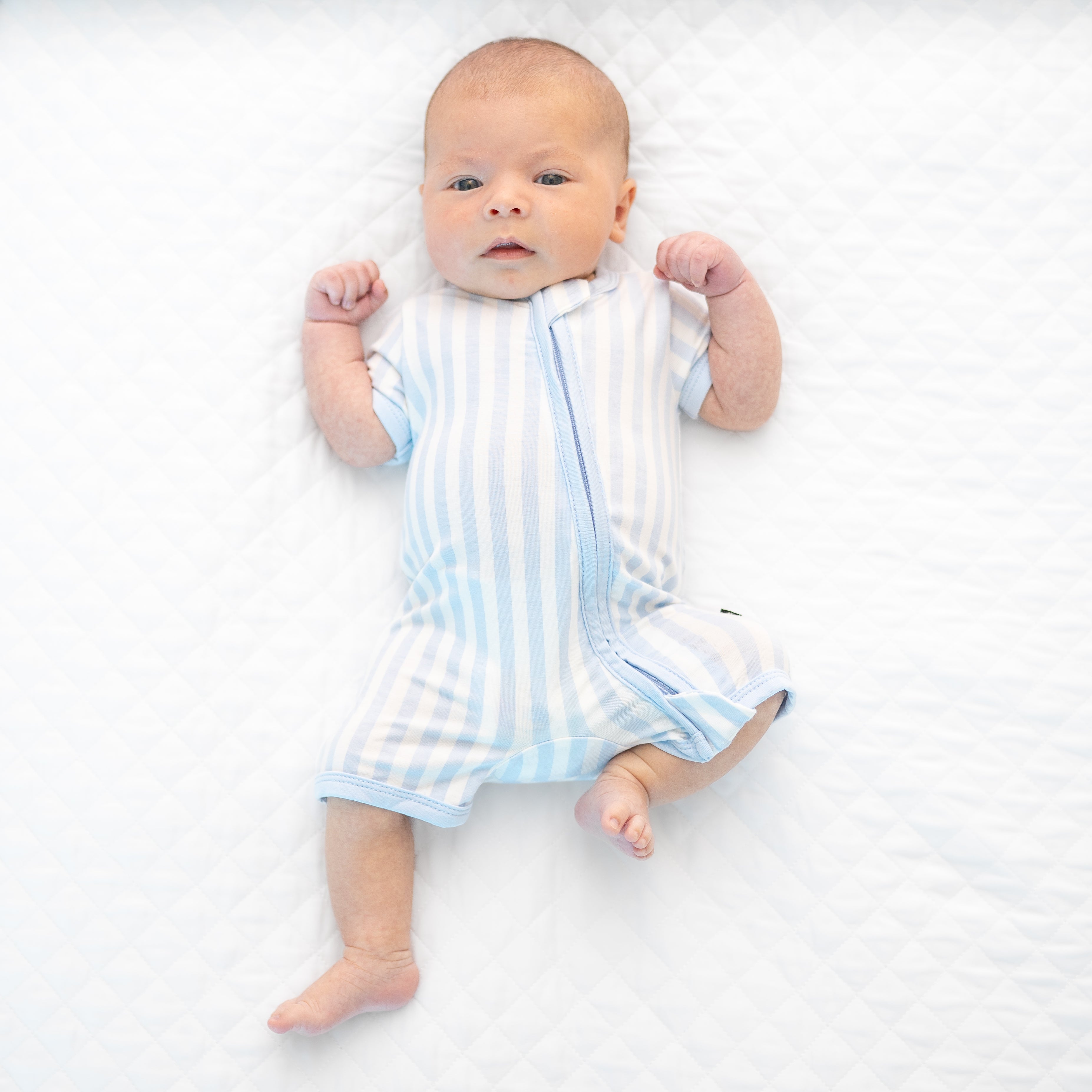 Baby wearing Zipper Shortall Romper in Mist Stripe