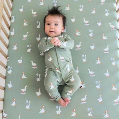 Baby wearing silly goose romper pajamas with snaps