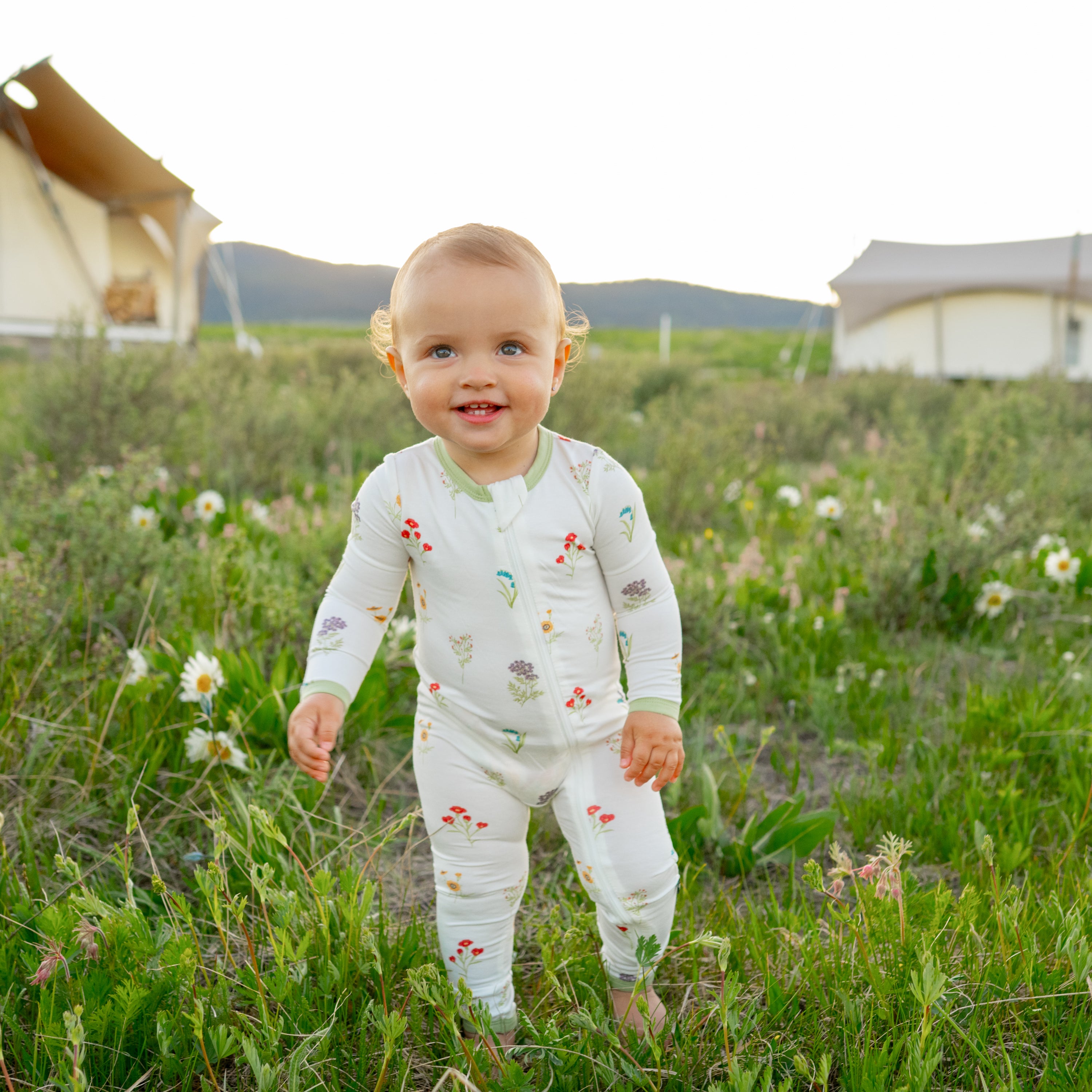 Toddler modeling Zippered Romper in Wildflower at Yellowstone National Park