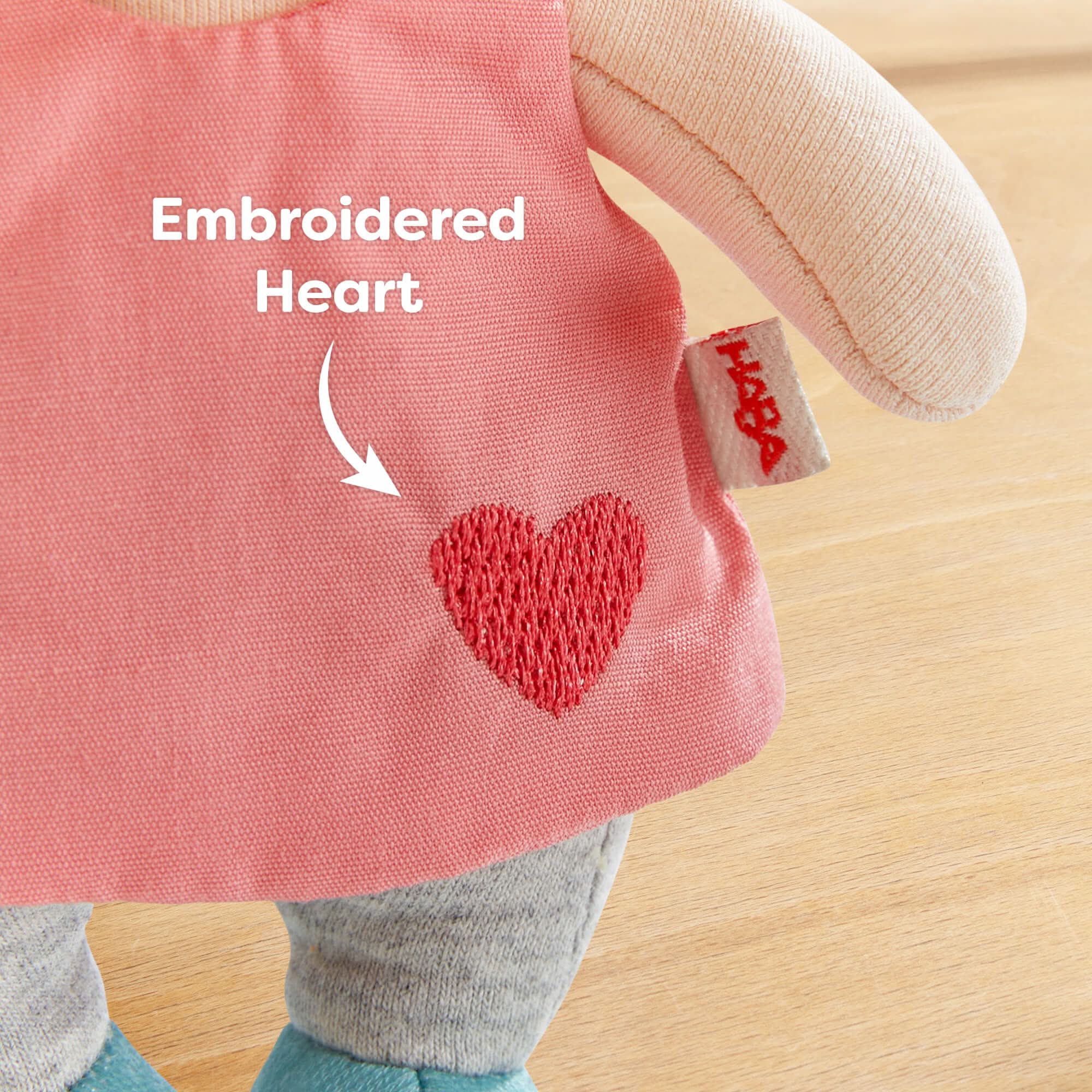 Pink dress has an embroidered heart