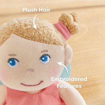 Guardian Angel Lucy has plush hair and embroidered features