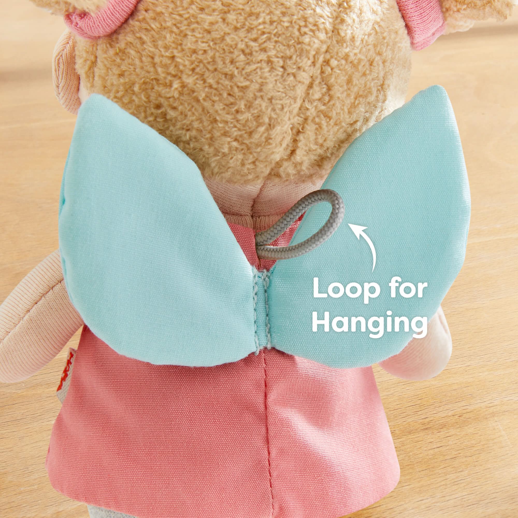 Back of doll has a loop for hanging