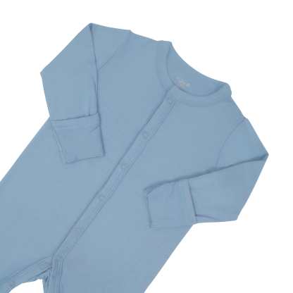 Close up of top portion of the Kyte Baby Romper in Slate with arms folded in