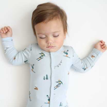 Close up of sleeping toddler wearing the Romper in Ski