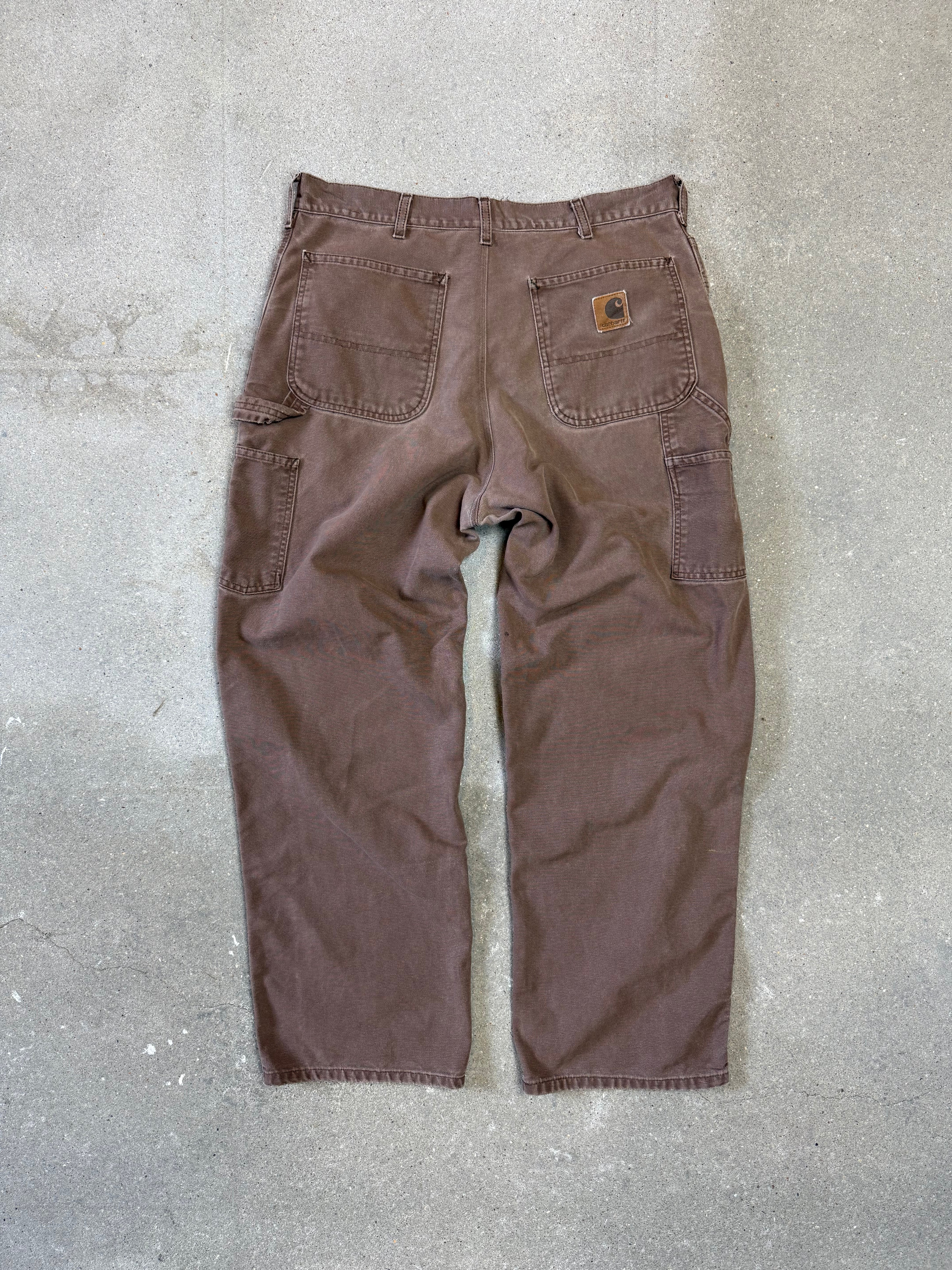 1990s Carhartt Baggy/Wide leg Cargo worker Pants in faded brown canvas. Size W34"L34 (fits W33"L34)
