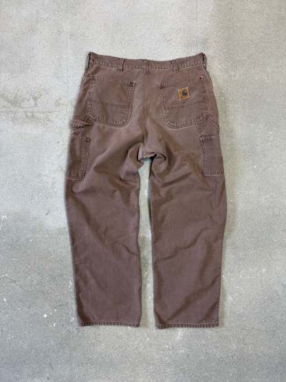 1990s Carhartt Baggy/Wide leg Cargo worker Pants in faded brown canvas. Size W34"L34 (fits W33"L34)