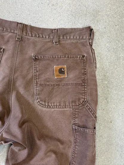 1990s Carhartt Baggy/Wide leg Cargo worker Pants in faded brown canvas. Size W34"L34 (fits W33"L34)