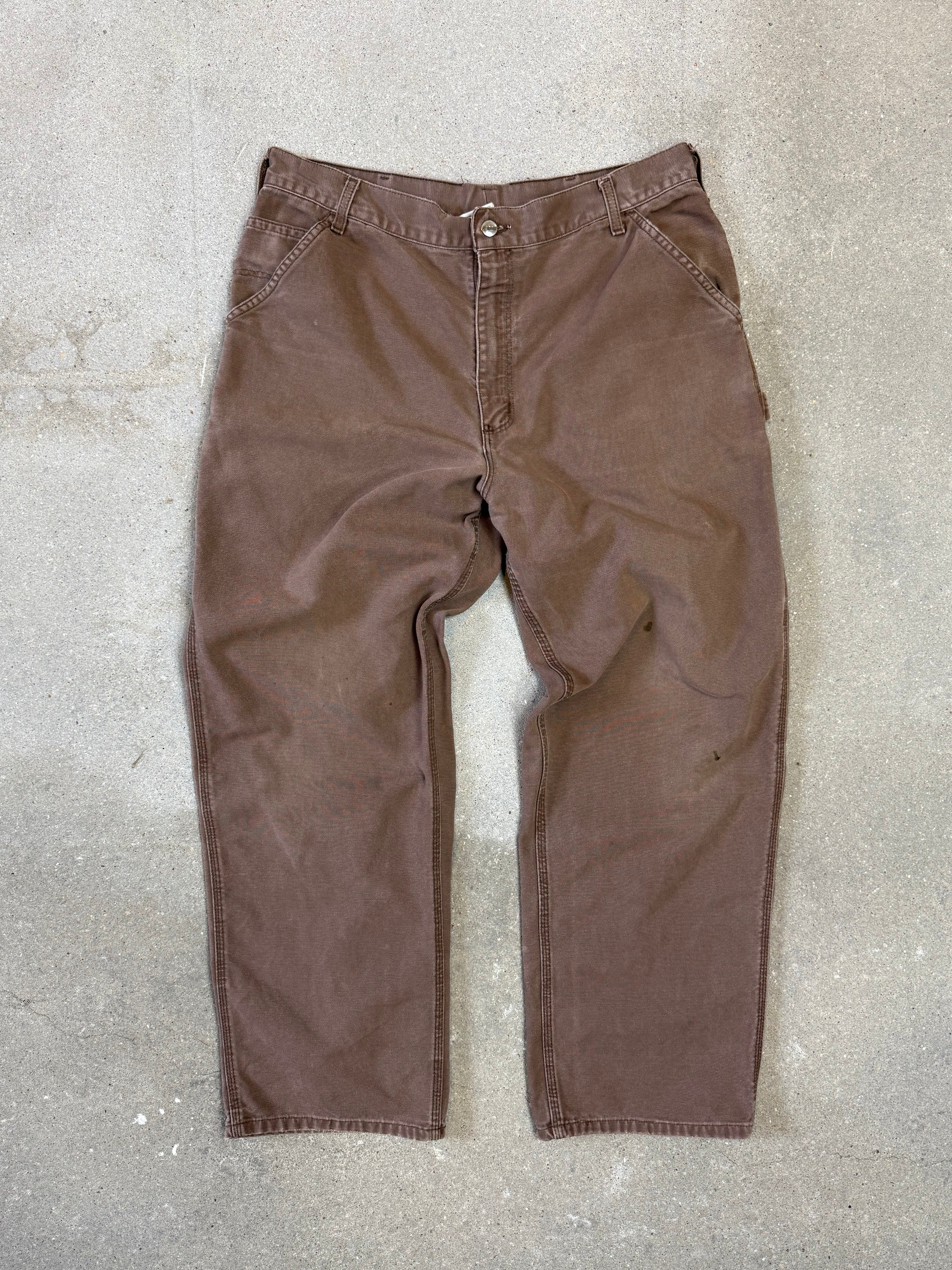 1990s Carhartt Baggy/Wide leg Cargo worker Pants in faded brown canvas. Size W34"L34 (fits W33"L34)