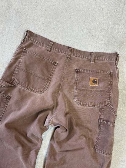 1990s Carhartt Baggy/Wide leg Cargo worker Pants in faded brown canvas. Size W34"L34 (fits W33"L34)
