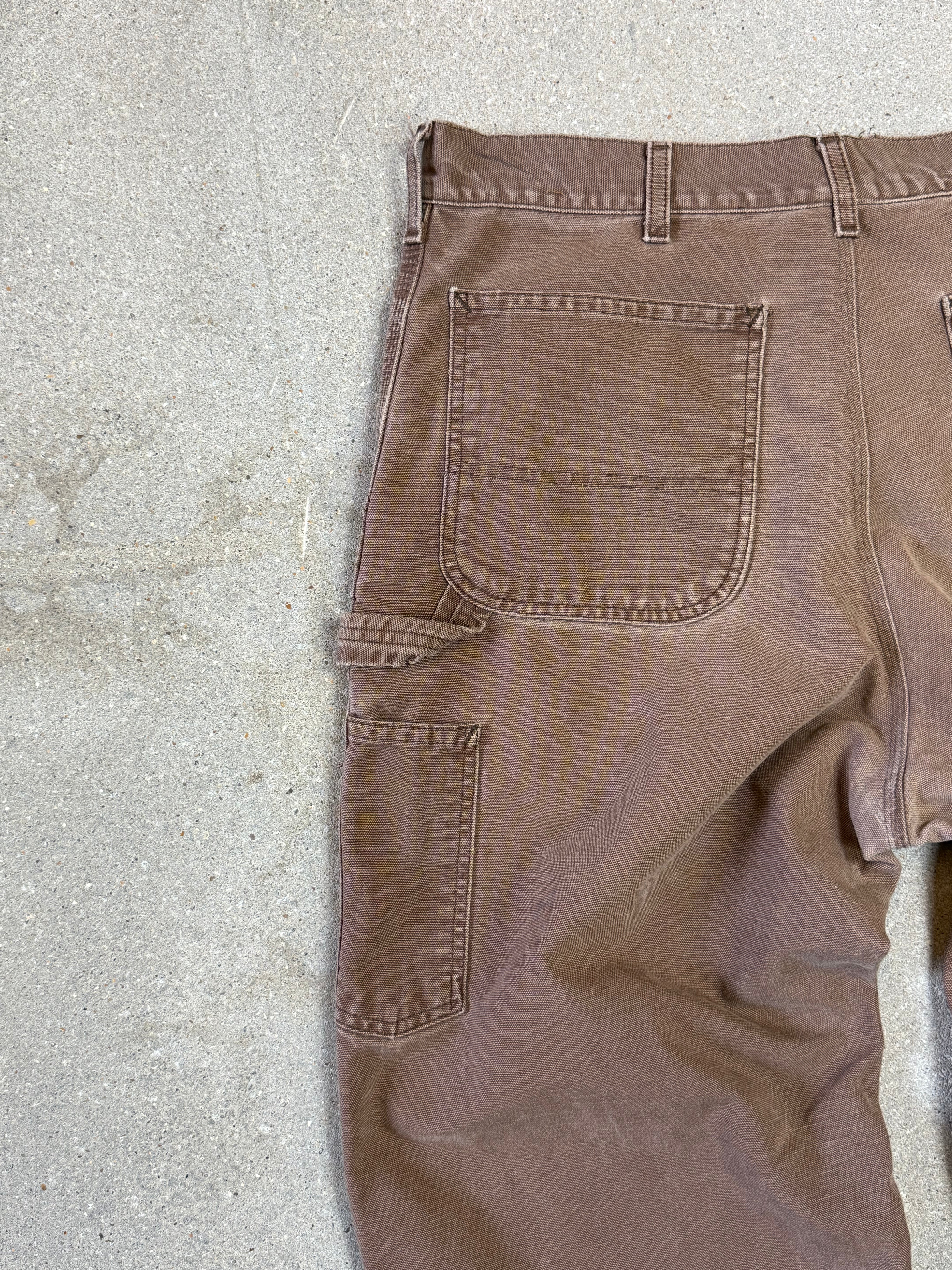 1990s Carhartt Baggy/Wide leg Cargo worker Pants in faded brown canvas. Size W34"L34 (fits W33"L34)