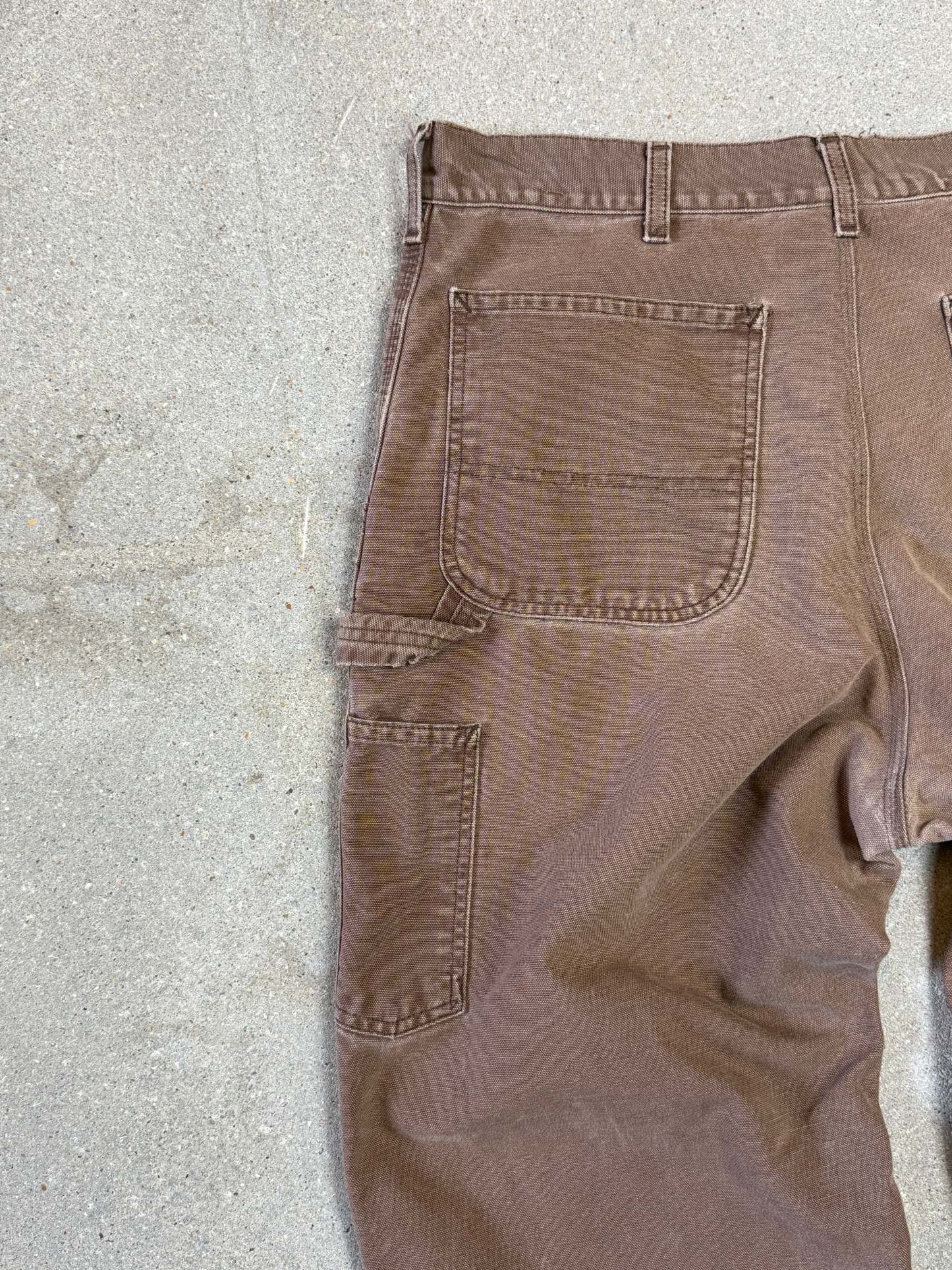 1990s Carhartt Baggy/Wide leg Cargo worker Pants in faded brown canvas. Size W34"L34 (fits W33"L34)