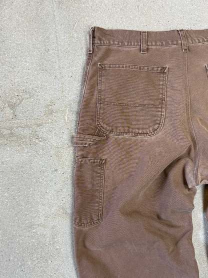 1990s Carhartt Baggy/Wide leg Cargo worker Pants in faded brown canvas. Size W34"L34 (fits W33"L34)