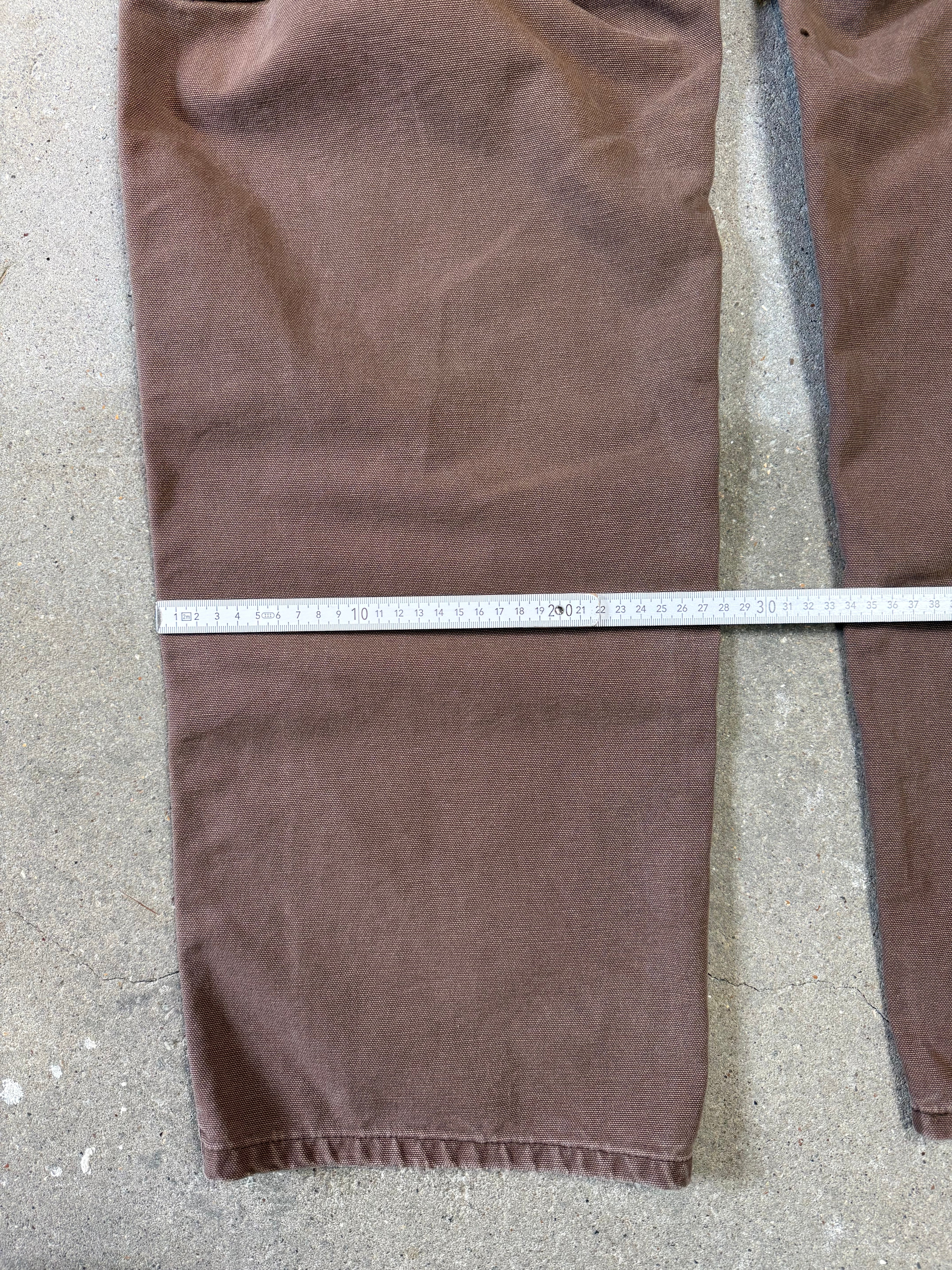 1990s Carhartt Baggy/Wide leg Cargo worker Pants in faded brown canvas. Size W34"L34 (fits W33"L34)