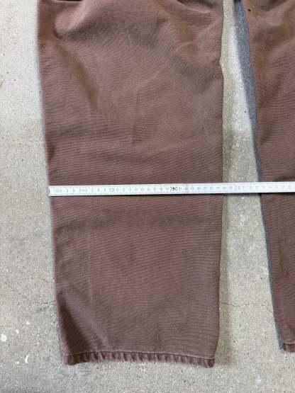 1990s Carhartt Baggy/Wide leg Cargo worker Pants in faded brown canvas. Size W34"L34 (fits W33"L34)