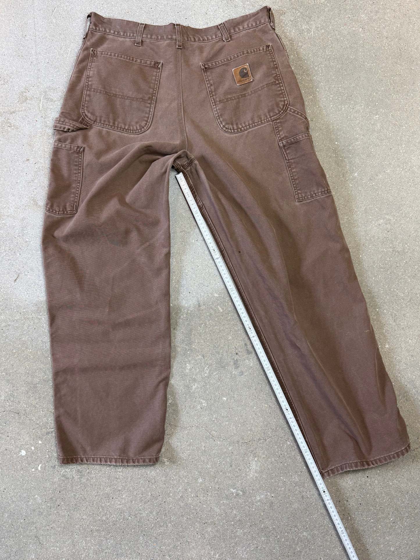 1990s Carhartt Baggy/Wide leg Cargo worker Pants in faded brown canvas. Size W34"L34 (fits W33"L34)