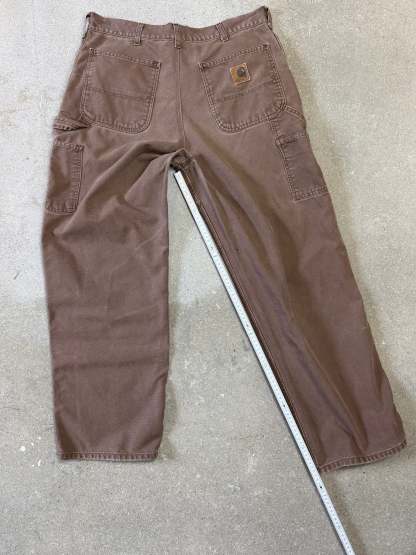 1990s Carhartt Baggy/Wide leg Cargo worker Pants in faded brown canvas. Size W34"L34 (fits W33"L34)