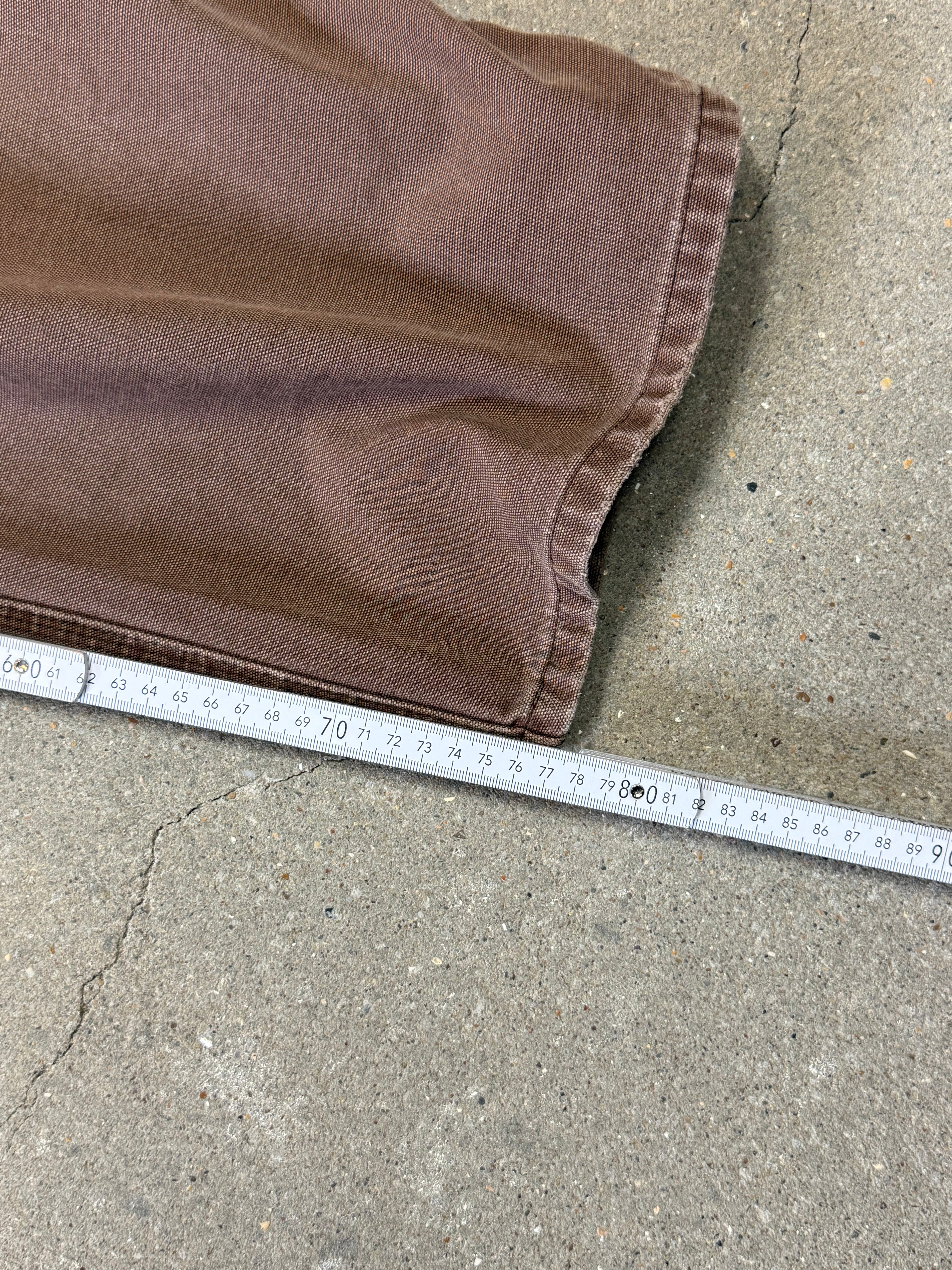 1990s Carhartt Baggy/Wide leg Cargo worker Pants in faded brown canvas. Size W34"L34 (fits W33"L34)