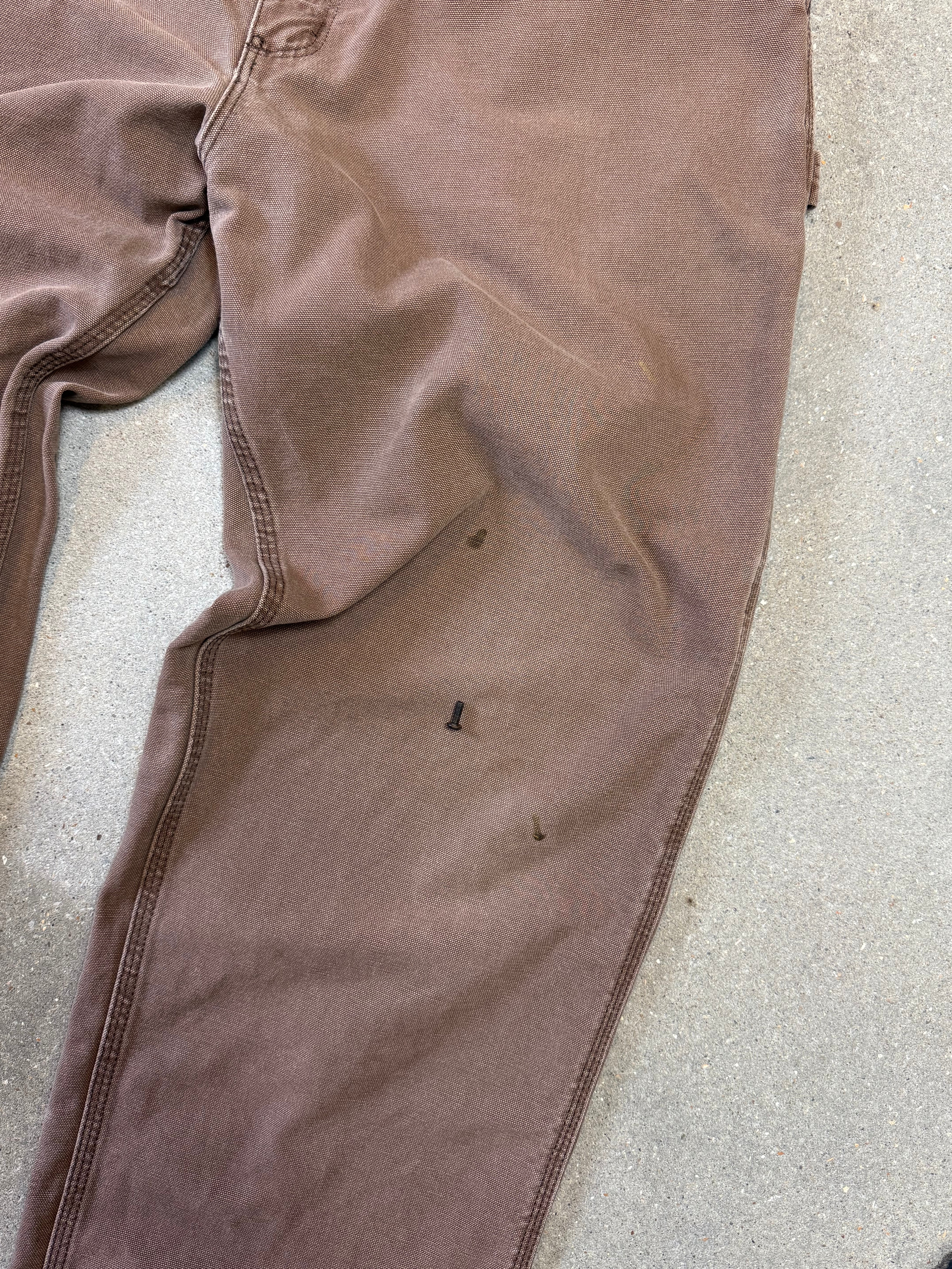 1990s Carhartt Baggy/Wide leg Cargo worker Pants in faded brown canvas. Size W34"L34 (fits W33"L34)