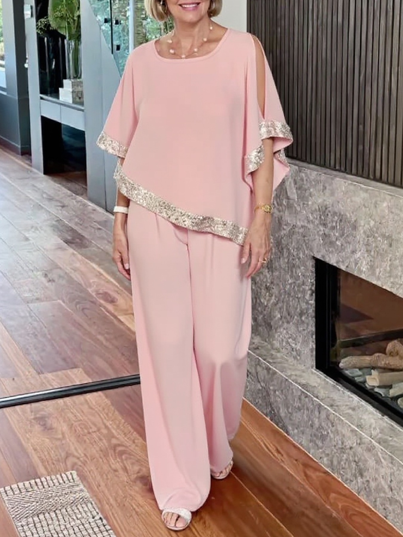 Woman in Pink Gold-Stitched Cloak-style Top and Wide-Legs Suit