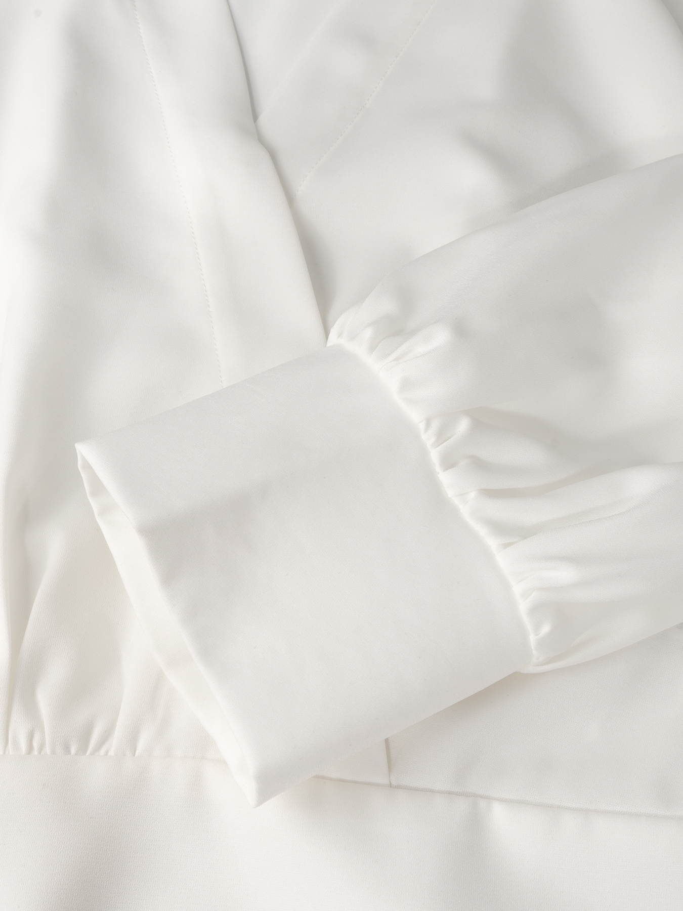 Woman's White Wrap Blouse & Black High-Waisted Flare Pants Two-Piece Set-Aegean-sea