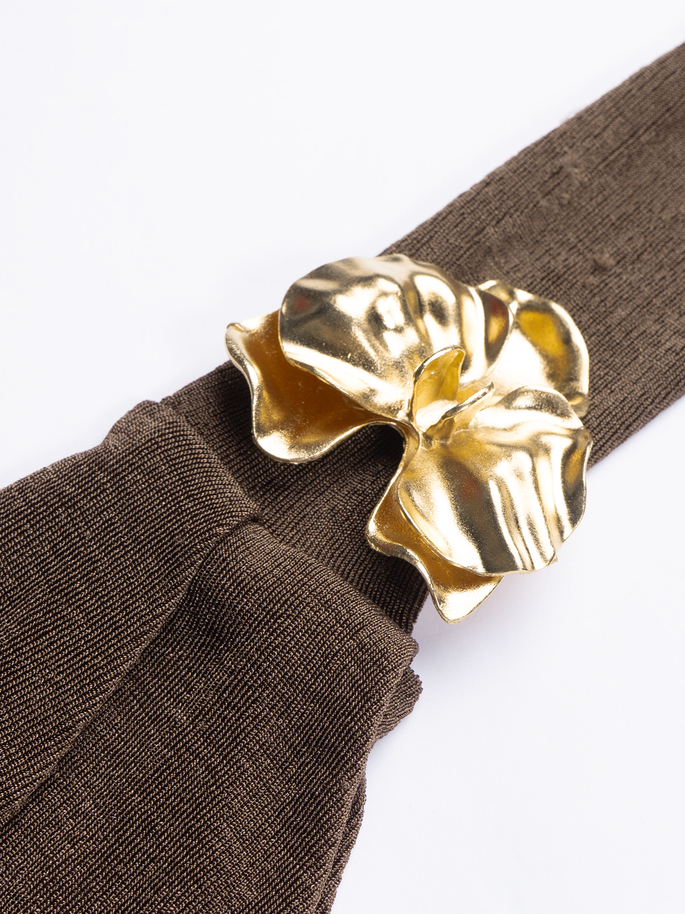 Chocolate-brown strapless mid-length woman‘s dress with one gold satin shoulder with little wheel accents