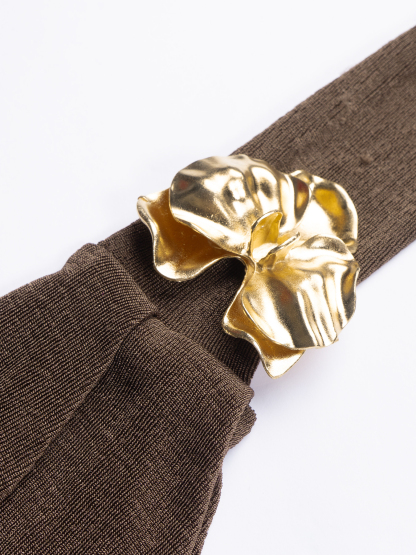 Chocolate-brown strapless mid-length woman‘s dress with one gold satin shoulder with little wheel accents