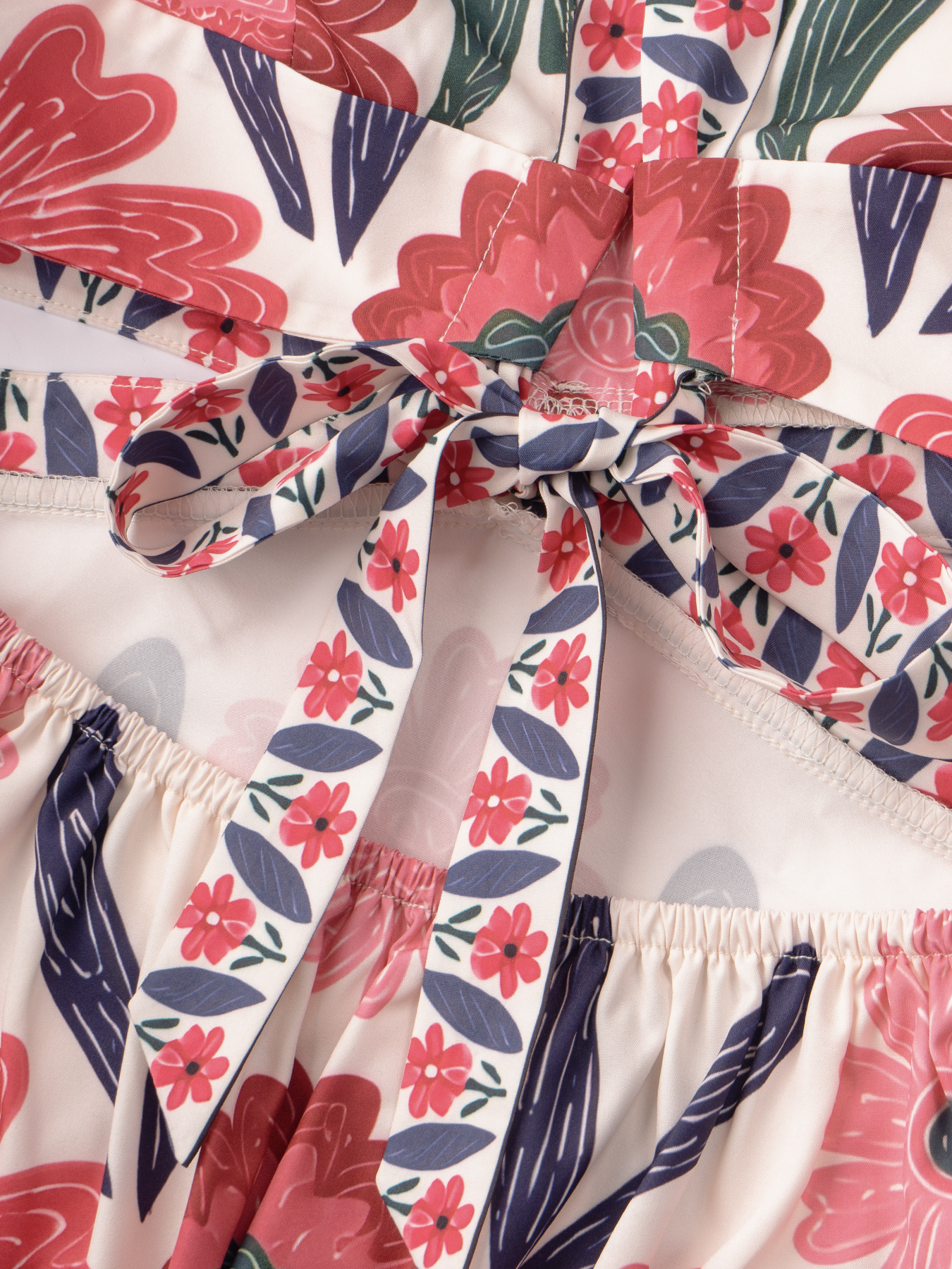 Women in flowered, neck-hanging dresses, cut-out, low-waisted, flowing dresses, holiday party dresses