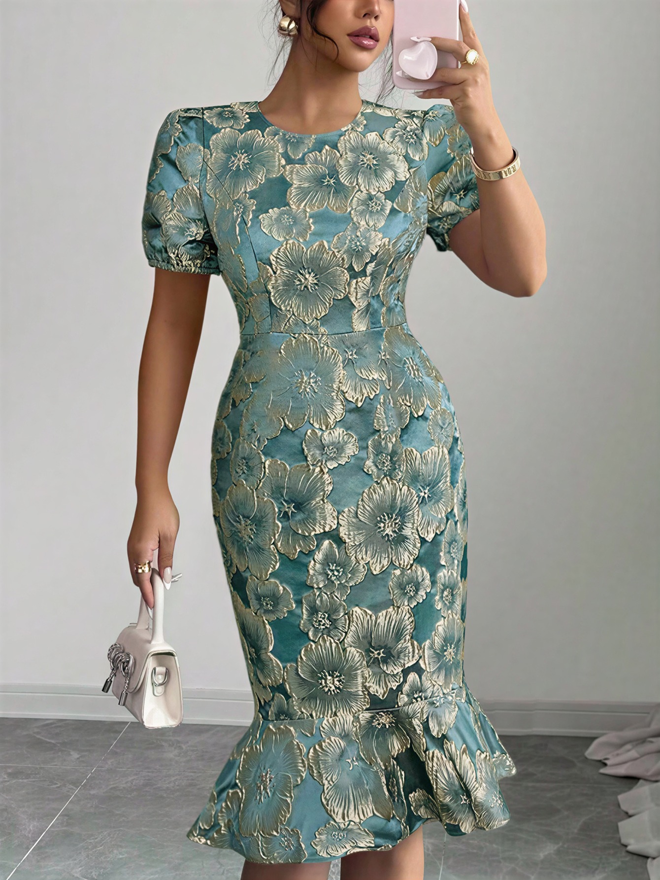 Women in flowered, bubble-sleeved, fish-tail dresses with waist-shrouding, hip-shrouding mid-skirts