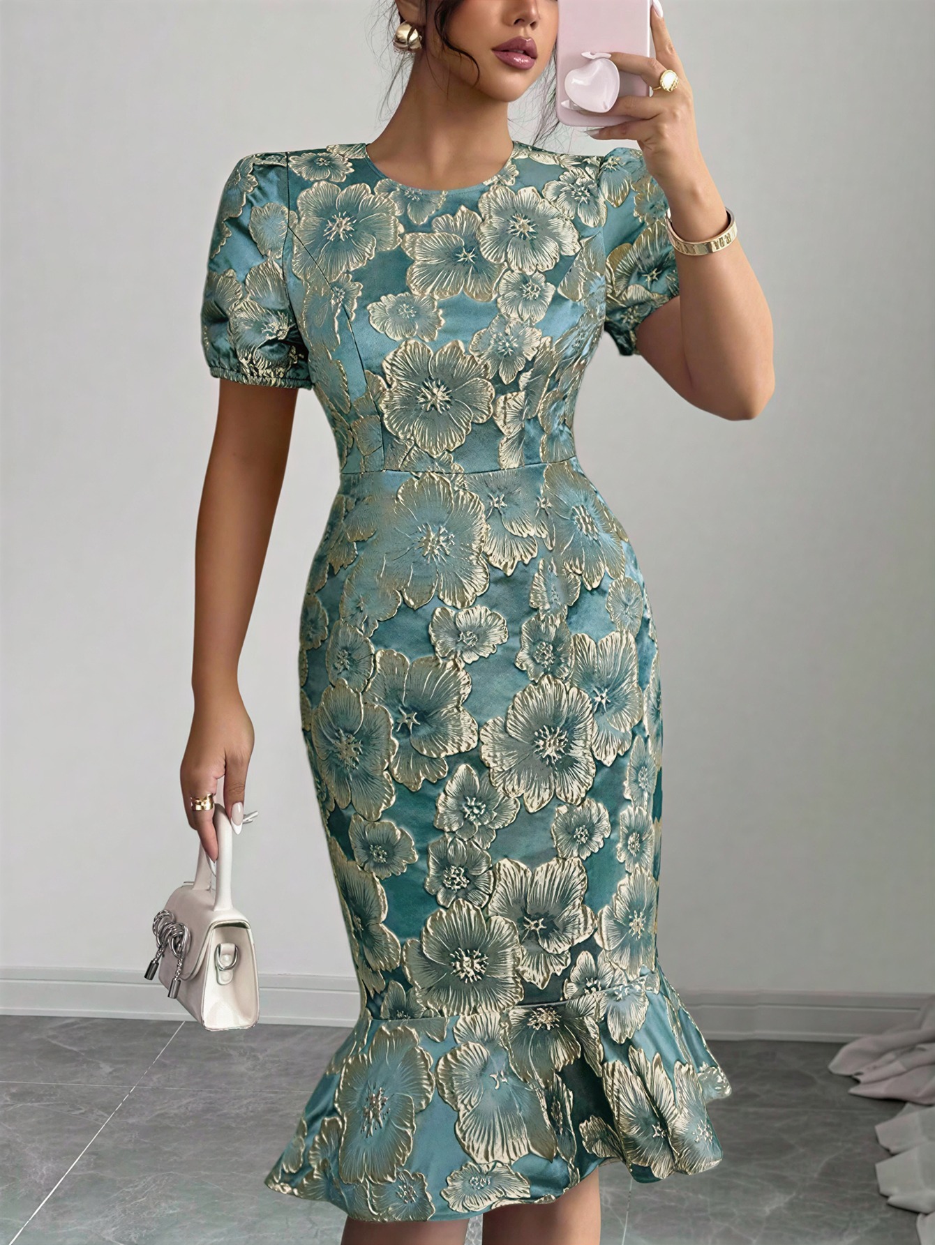 Women in flowered, bubble-sleeved, fish-tail dresses with waist-shrouding, hip-shrouding mid-skirts