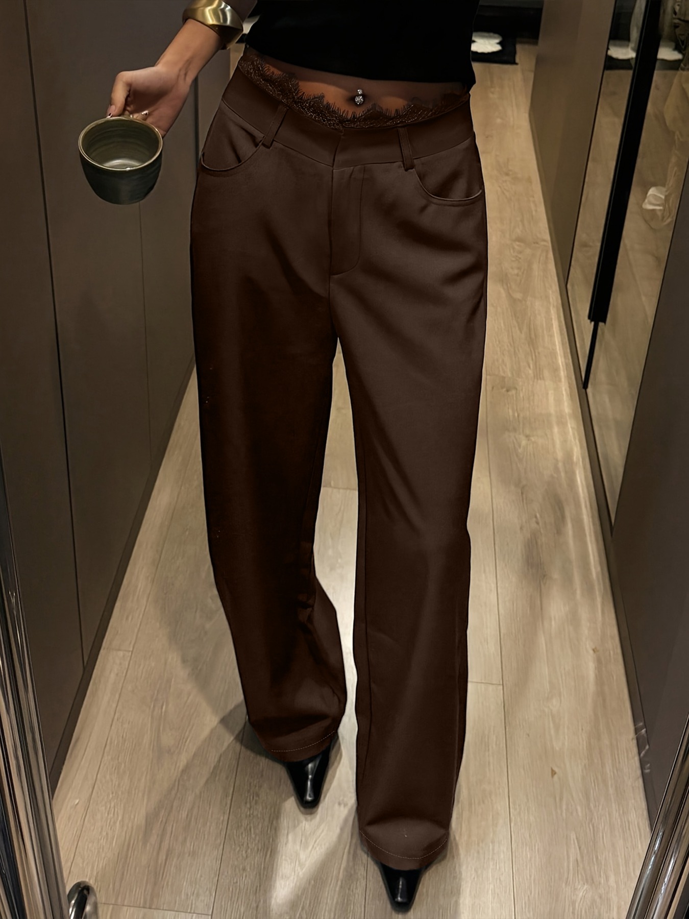hot girl style high-waisted wide-legged pants. Lace-waisted work suit pants. Thin-looking charcoal-black pants.