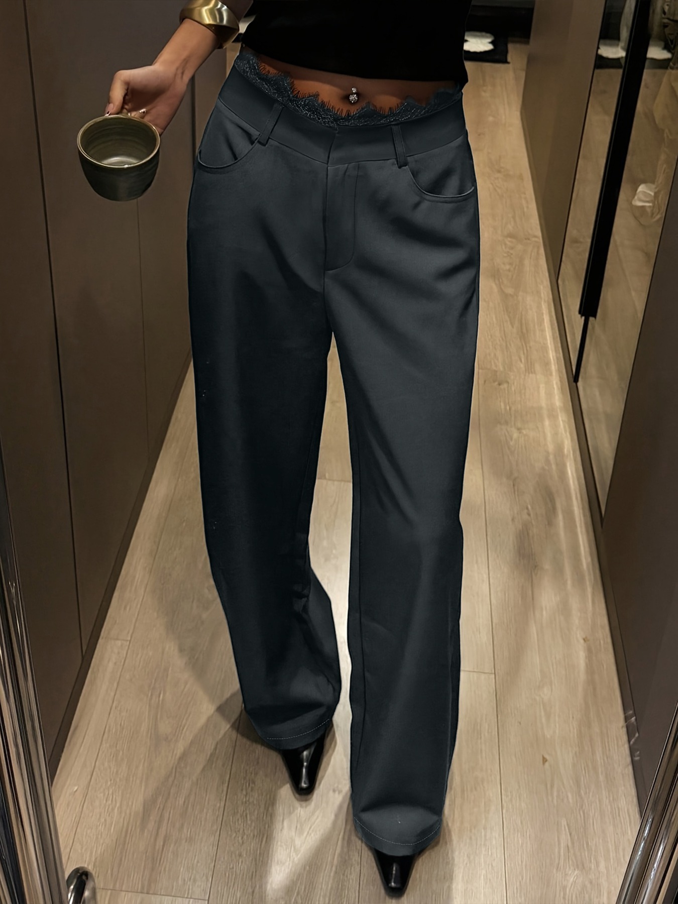 hot girl style high-waisted wide-legged pants. Lace-waisted work suit pants. Thin-looking charcoal-black pants.