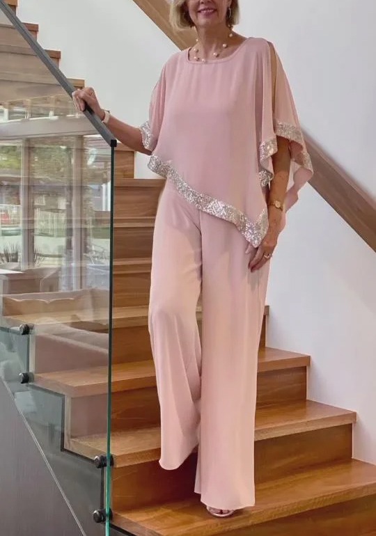 Woman in Pink Gold-Stitched Cloak-style Top and Wide-Legs Suit