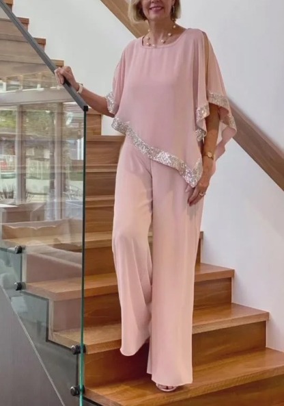 Woman in Pink Gold-Stitched Cloak-style Top and Wide-Legs Suit