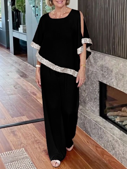 Woman in Pink Gold-Stitched Cloak-style Top and Wide-Legs Suit