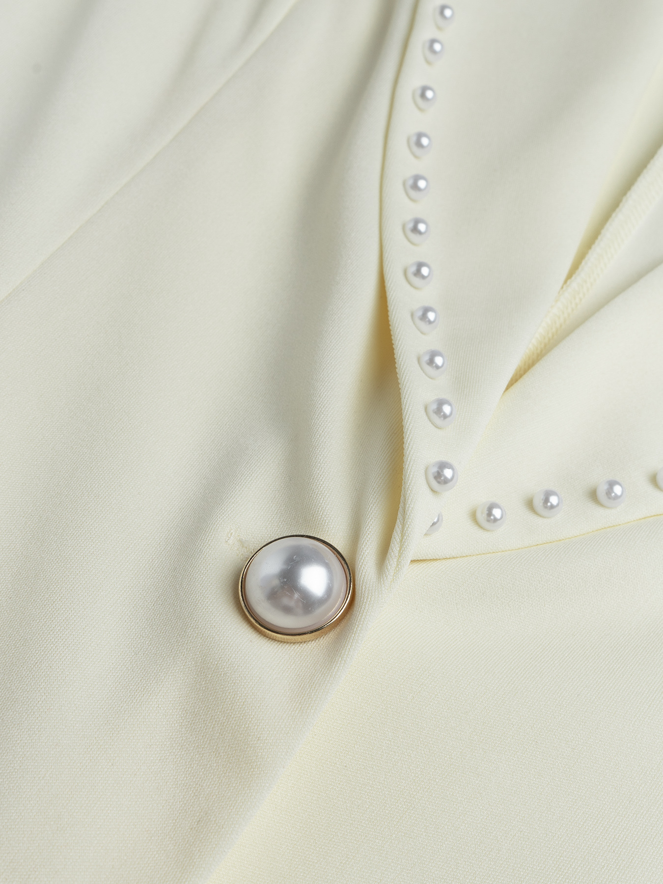Elegant Cream Fitted Blazer with Pearl-Trimmed Lapel & Slim Waist-Aegean-sea