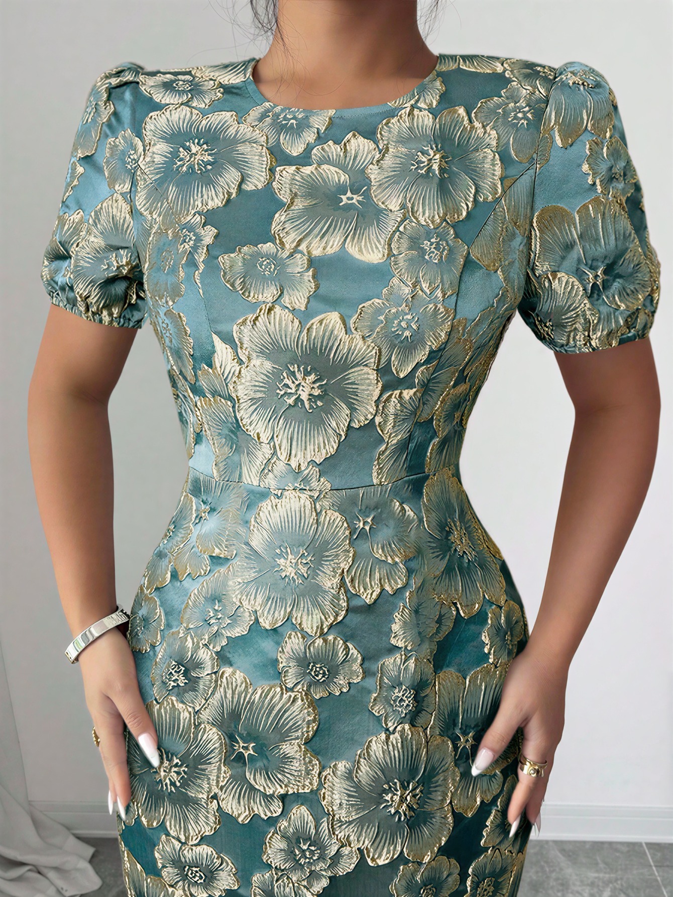 Women in flowered, bubble-sleeved, fish-tail dresses with waist-shrouding, hip-shrouding mid-skirts