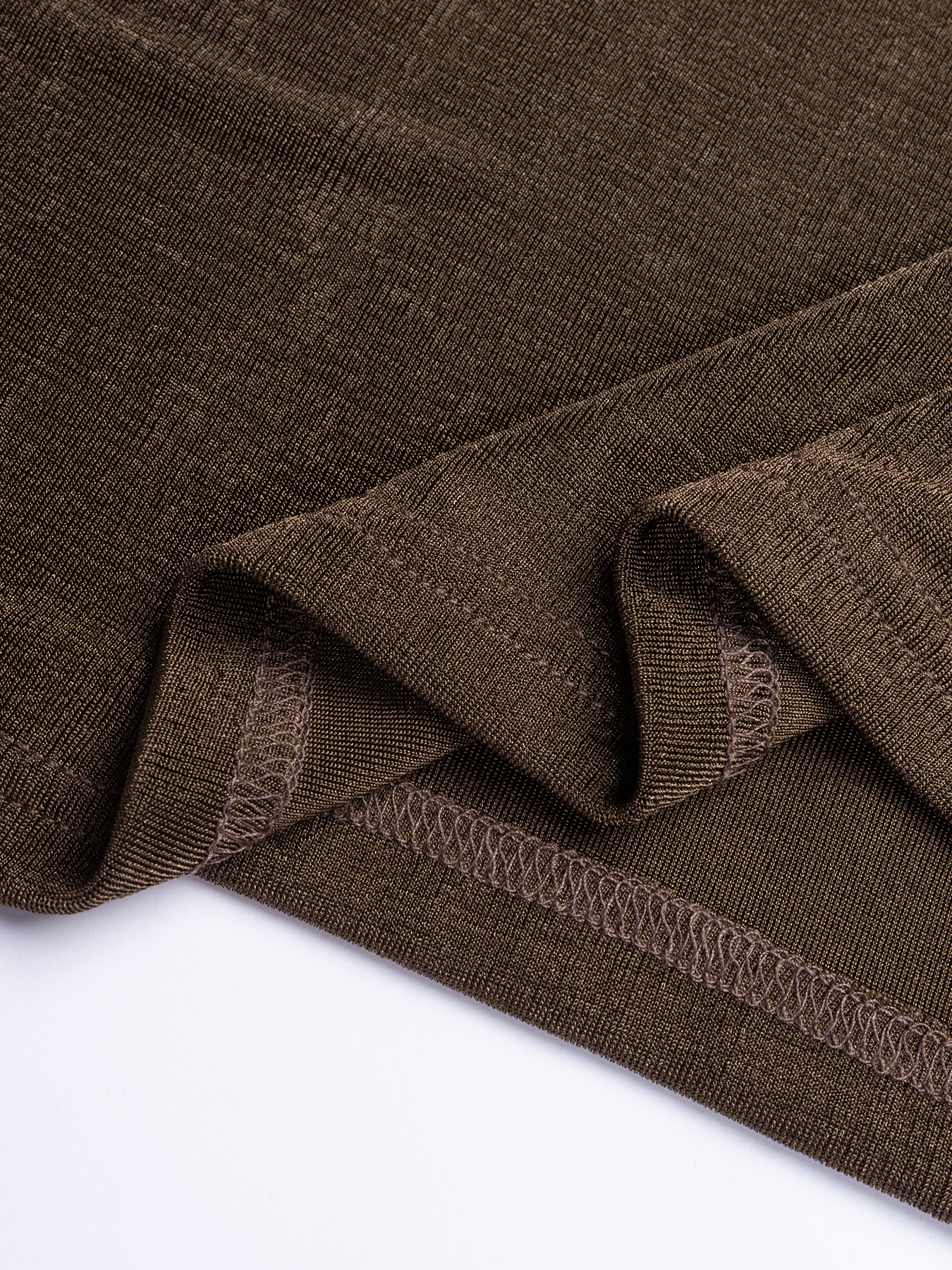 Chocolate-brown strapless mid-length woman‘s dress with one gold satin shoulder with little wheel accents