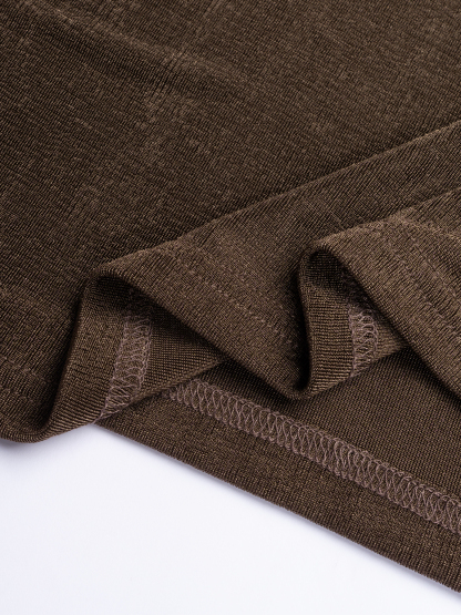 Chocolate-brown strapless mid-length woman‘s dress with one gold satin shoulder with little wheel accents