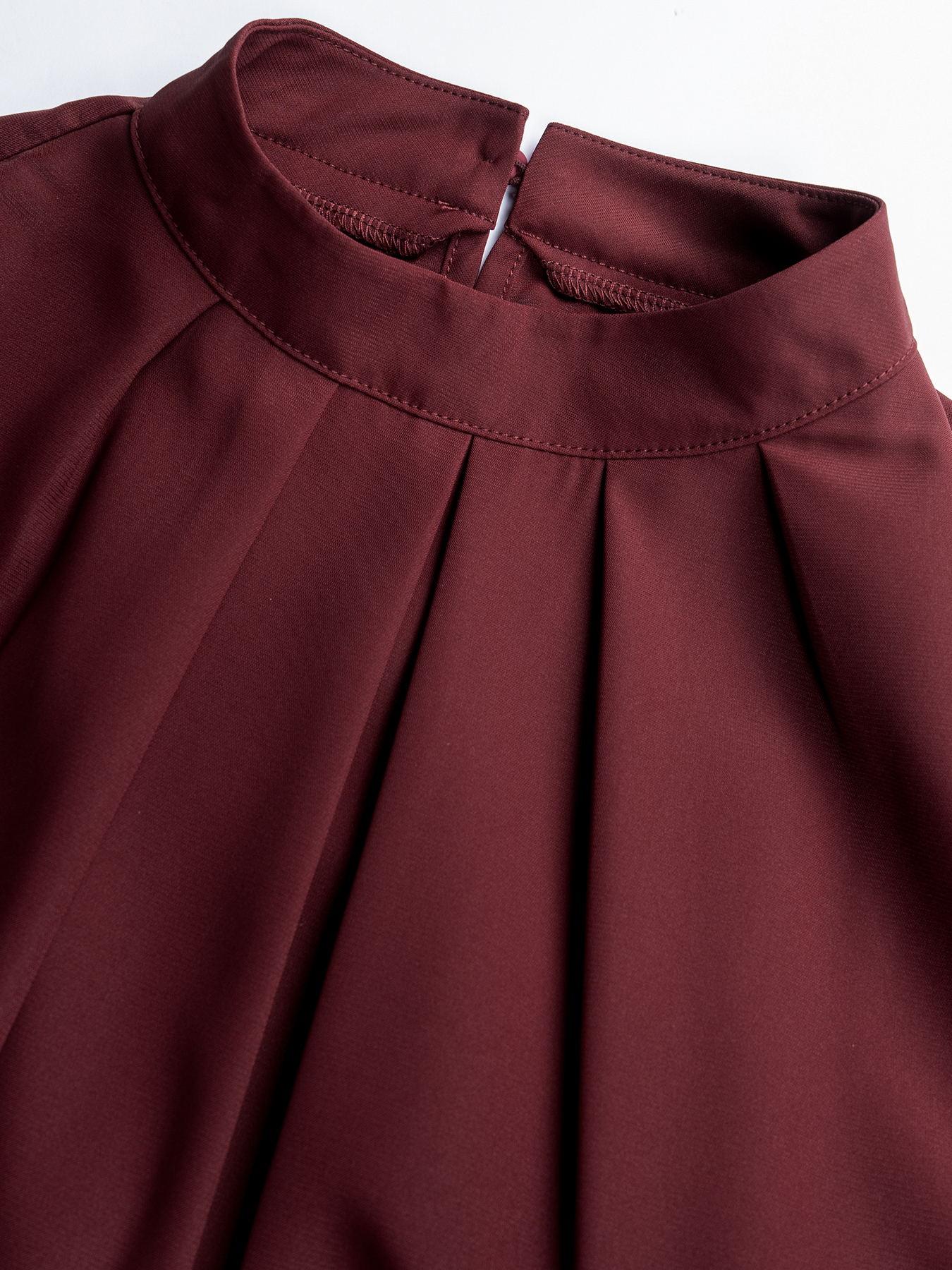 Woman's High Neck Puff Sleeve Peplum Top with Smocked Waist