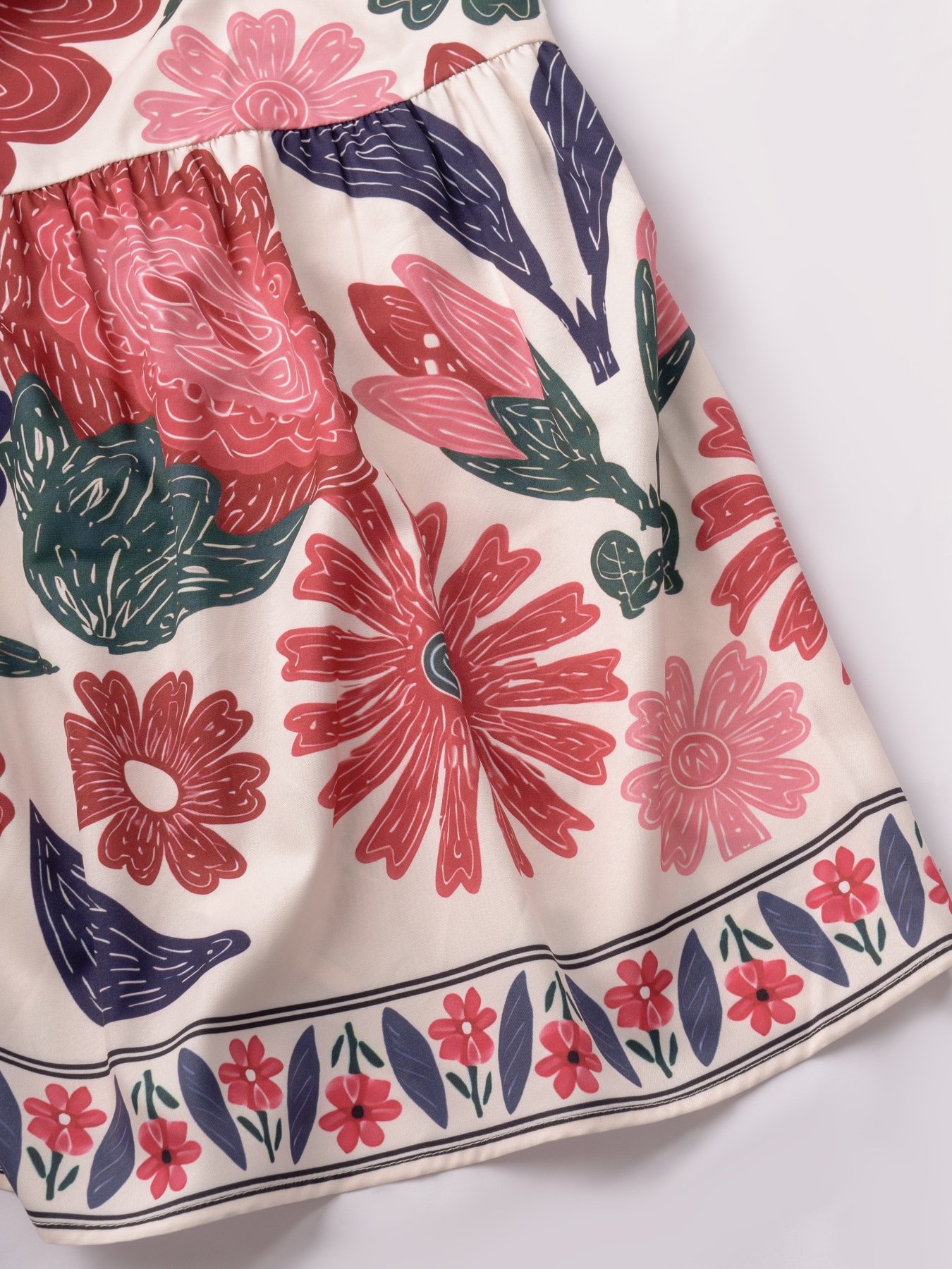 Women in flowered, neck-hanging dresses, cut-out, low-waisted, flowing dresses, holiday party dresses