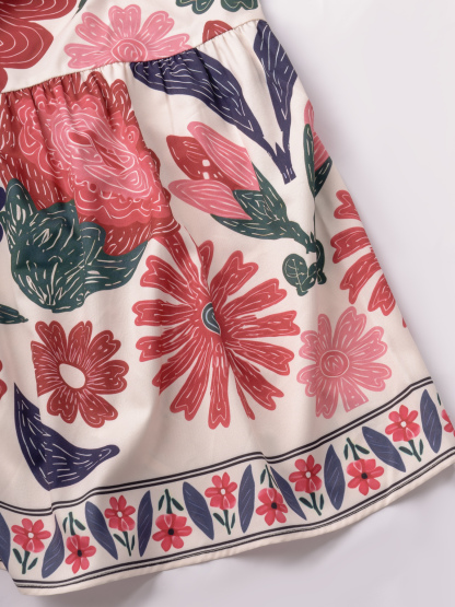 Women in flowered, neck-hanging dresses, cut-out, low-waisted, flowing dresses, holiday party dresses