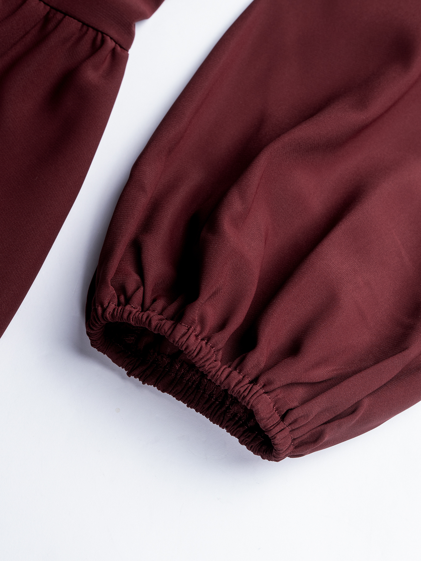 Woman's High Neck Puff Sleeve Peplum Top with Smocked Waist