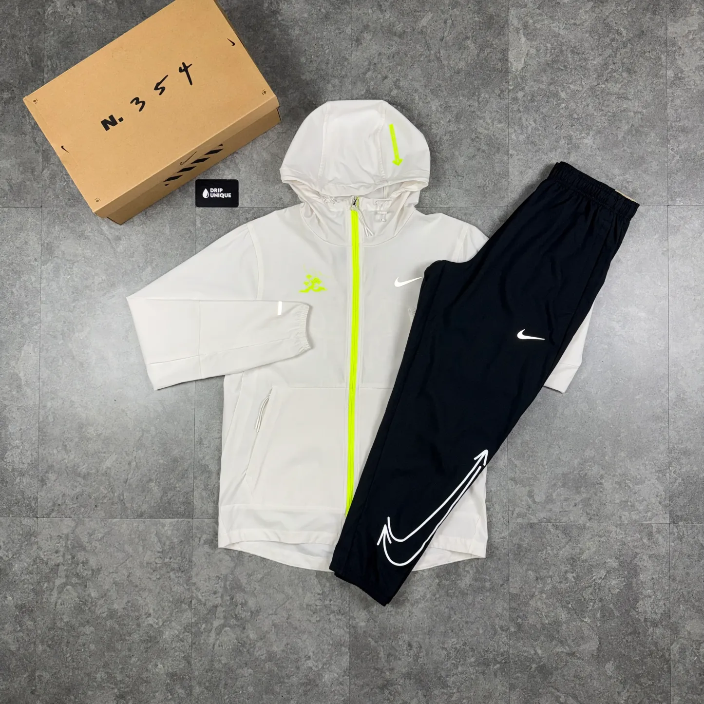 Nike Repel “Just Do It” Windrunner Jacket White & Black Nike “Just Do It” Challenger Pants Set