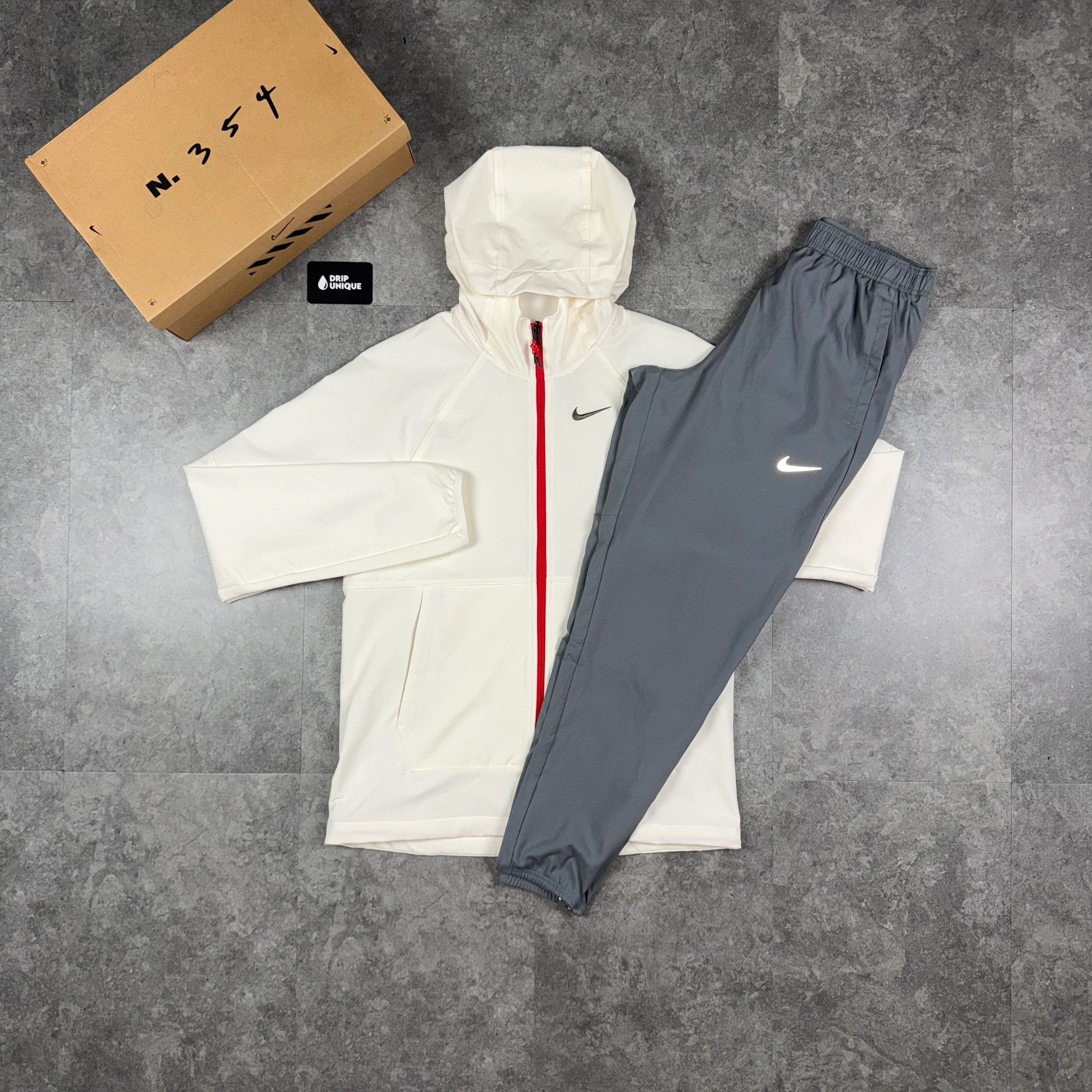 Nike Repel “Just Do It” Windrunner Jacket Chilli Red & Grey Nike Challenger Pants Set