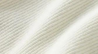 A MODEL POSES WEARING SKIMS COTTON RIB