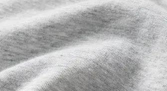 A MODEL POSES WEARING SKIMS COTTON JERSEY